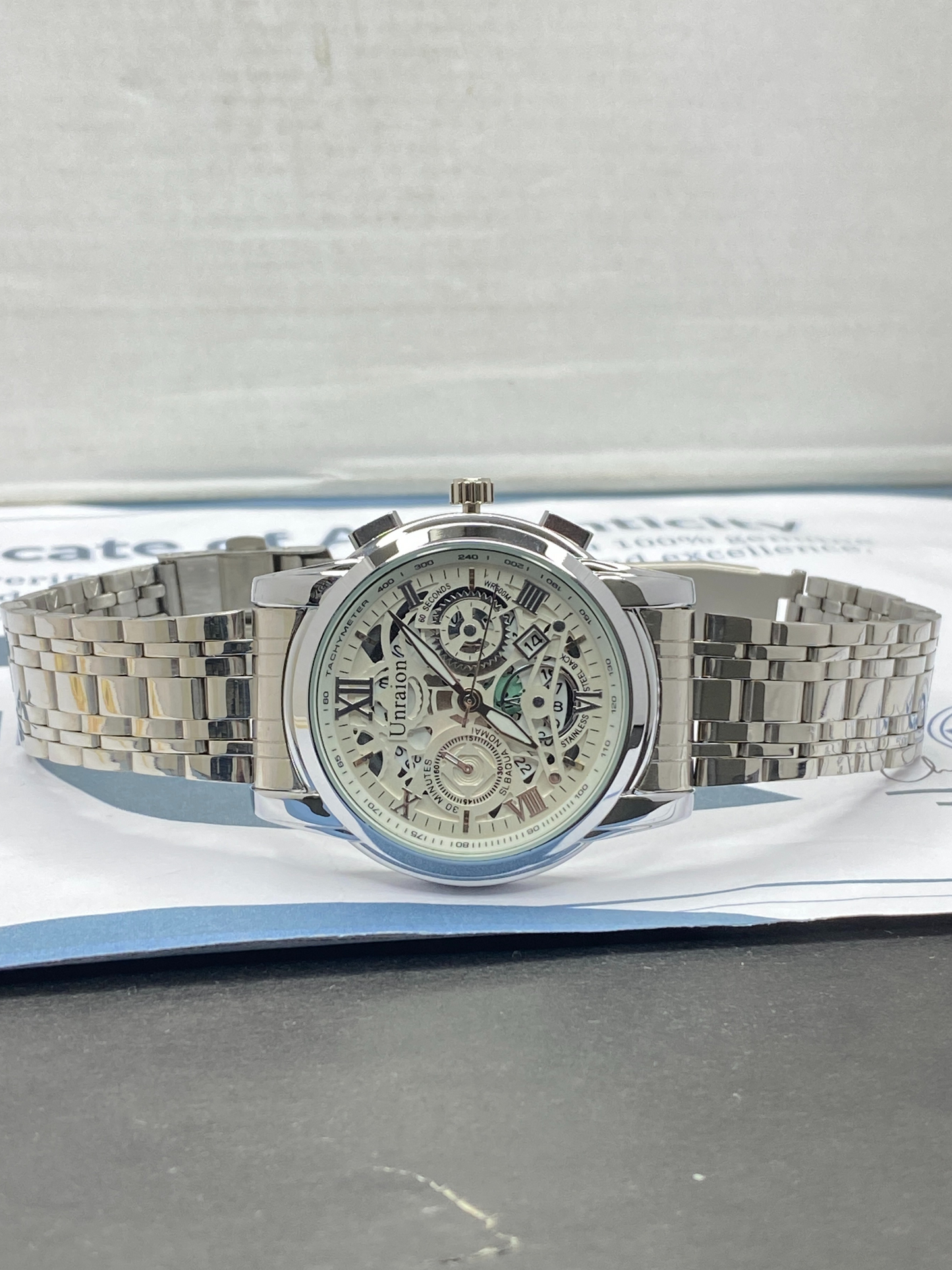 UNRAION Men’s Skeleton Dial Stainless Steel Chain Analog Watch with Date Display