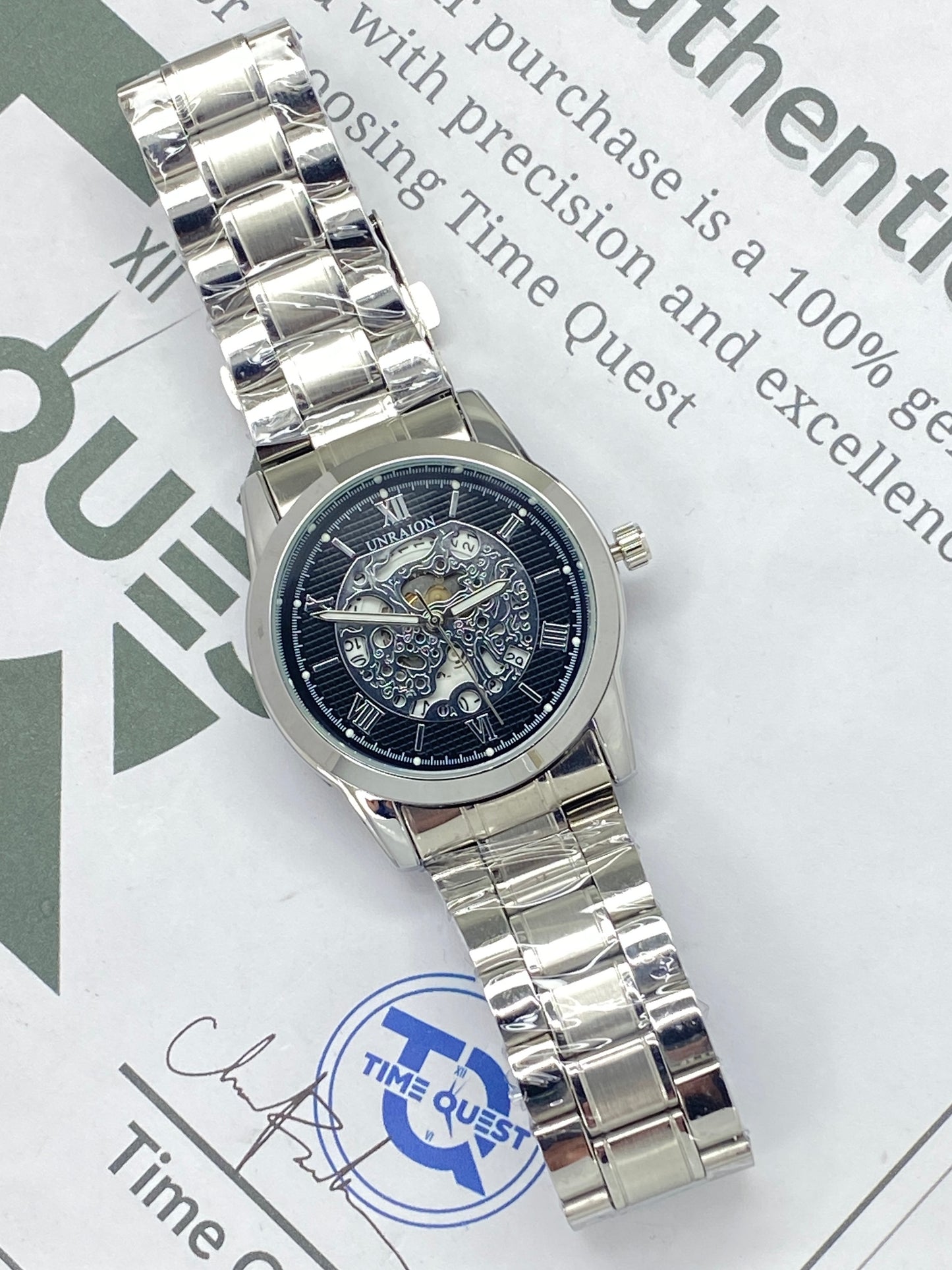 UNRAION Analog Skeleton Dial Stainless Steel Chain Watch for Men with Quartz Movement Date Display