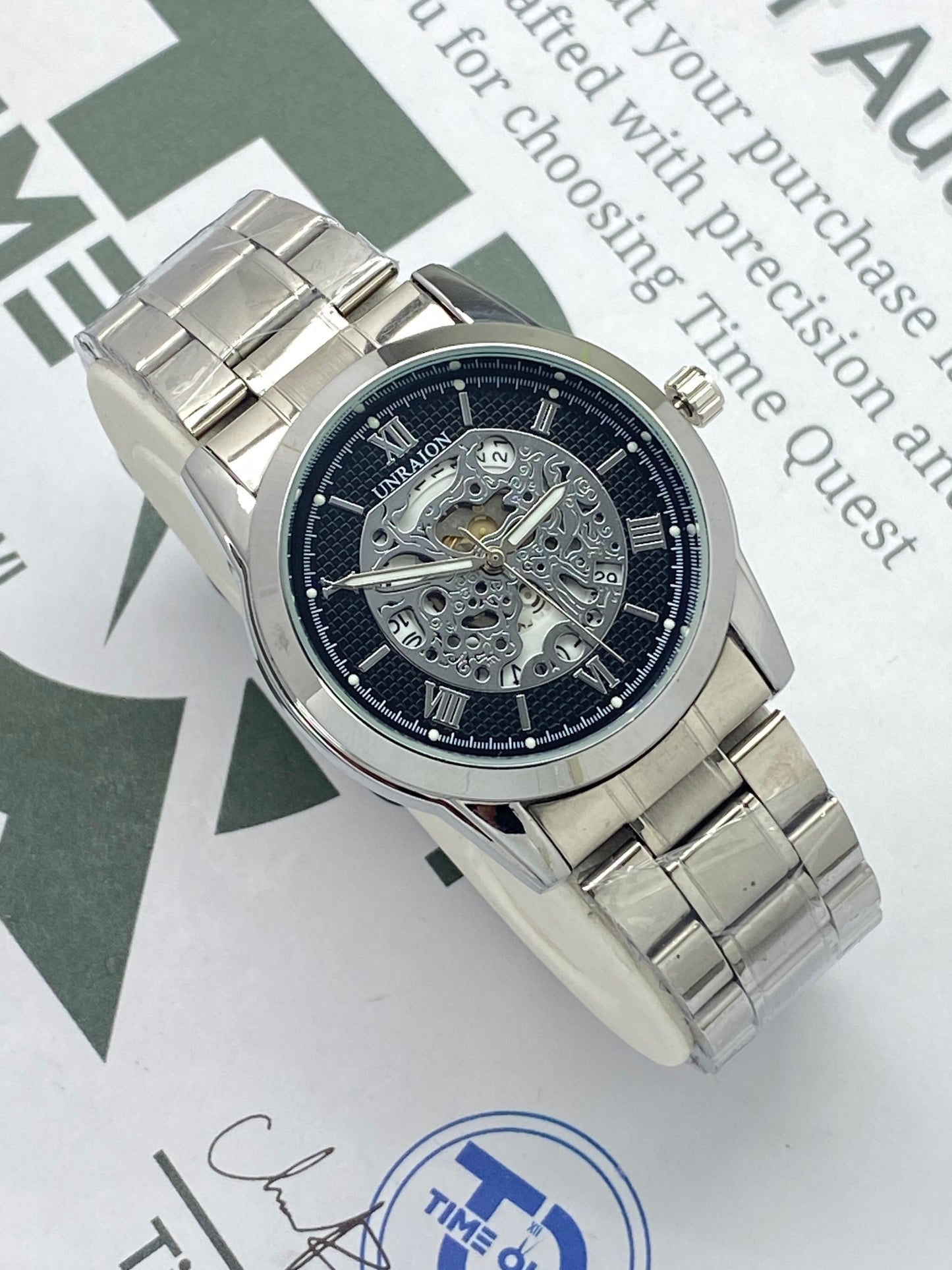 UNRAION Analog Skeleton Dial Stainless Steel Chain Watch for Men with Quartz Movement Date Display