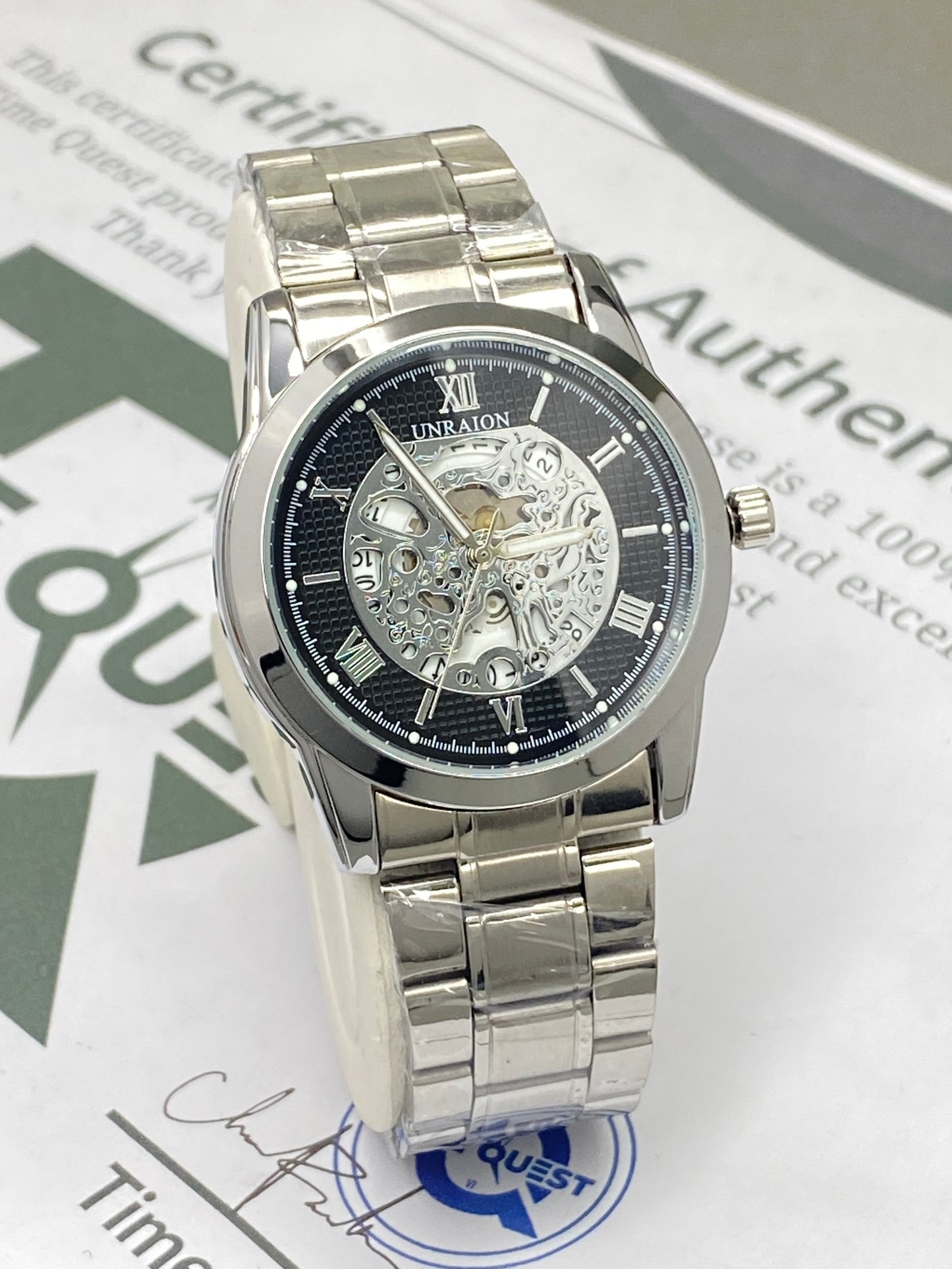 UNRAION Analog Skeleton Dial Stainless Steel Chain Watch for Men with Quartz Movement Date Display